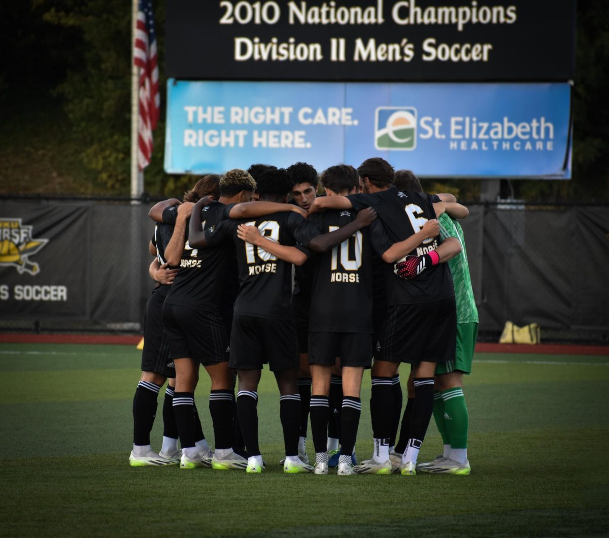 Sam Robinson leading team huddle