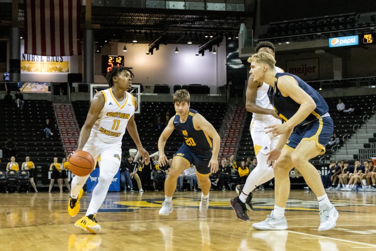 Randall Pettus II for NKU dribbles the ball across the court during the exhibition at Truist Arena.
