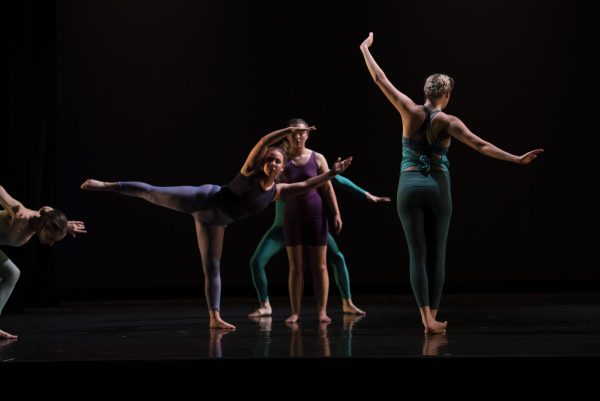 Emily Hilbrecht does a hinge side tilt on stage during Dance ‘22. 