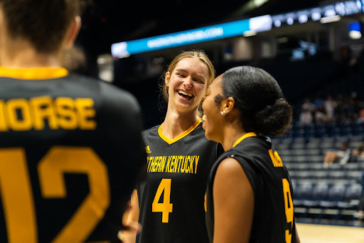 Shelby laughing with her teammates.