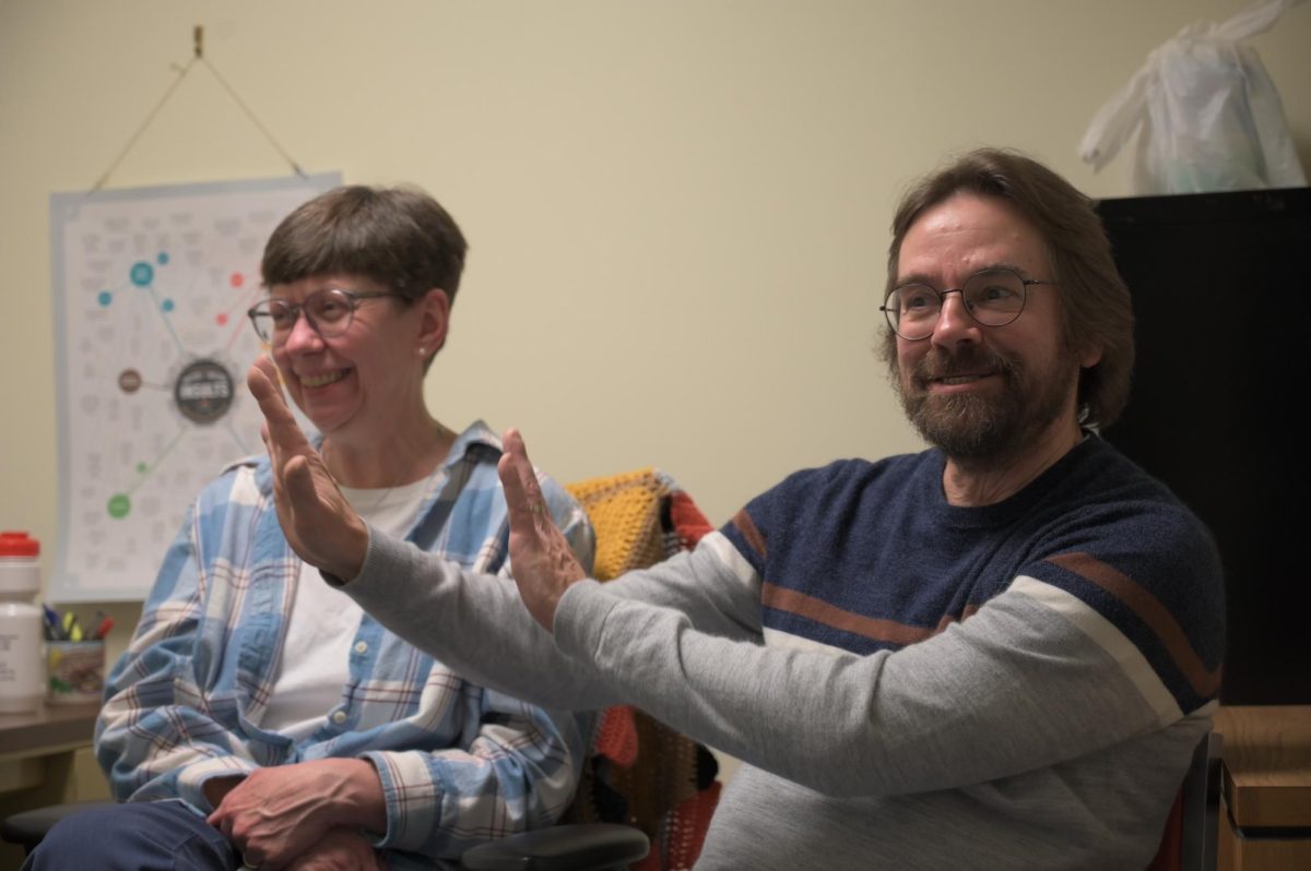 Nancy and Thomas sit in Nancy’s office in Landrum Academic Center, where they have offices on the same floor.