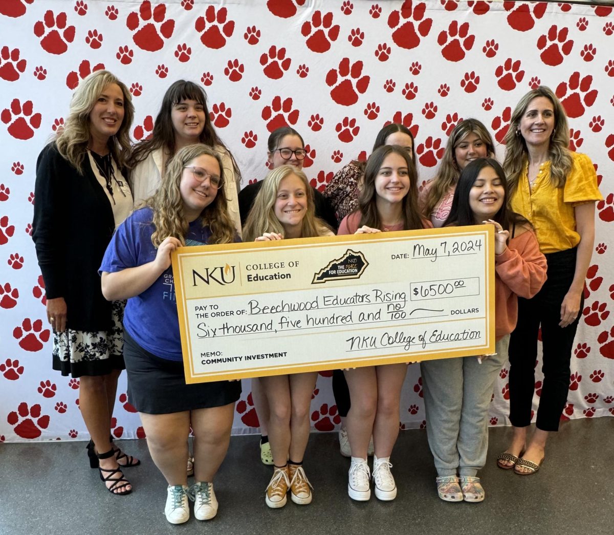 Administrators from NKU's College of Education presented a check to Beechwood High School students on Tuesday to help them attend a national competition.