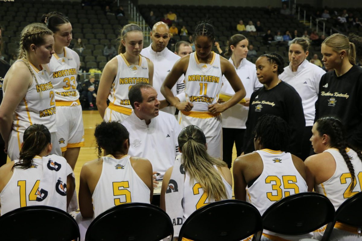 Head Coach Jeff Hans leading the team in the huddle.