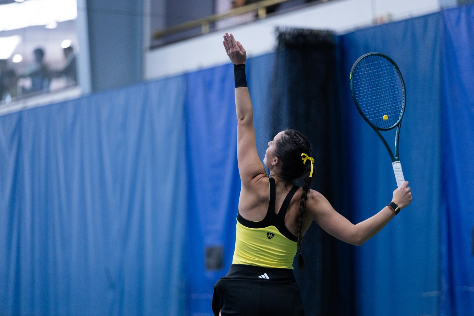   Ashlee Fisk getting ready set for a serve. She won the lone singles match for the Norse on Sunday in their final home game, pulling out 6-2, 7-5 victories.