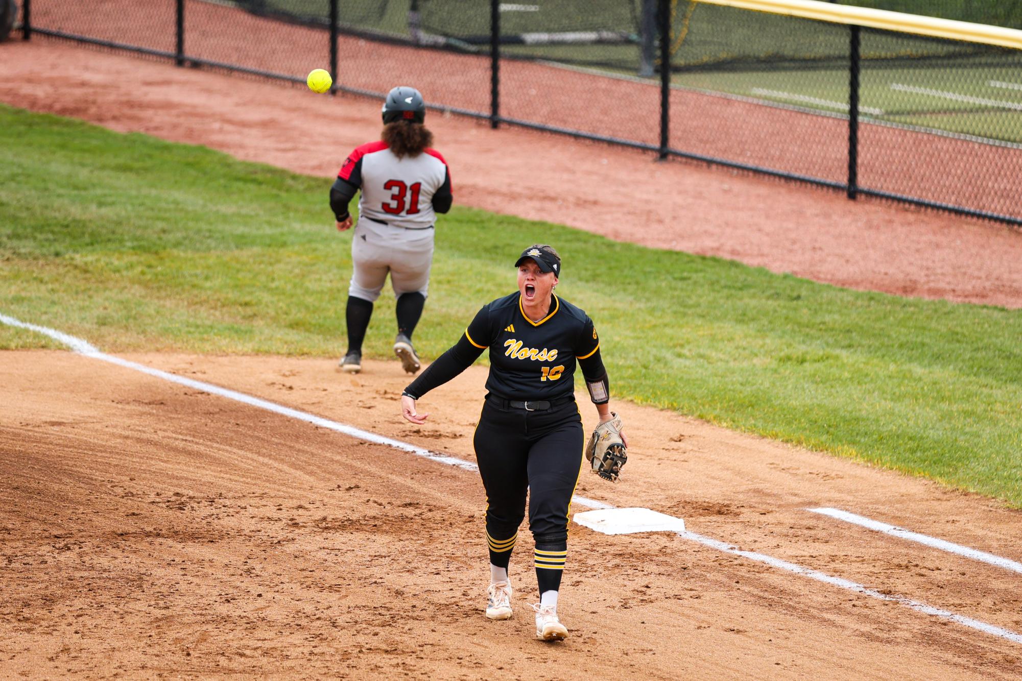 Senior Trinity Robertson (19) getting the team fired up after an inning-ending ground out.