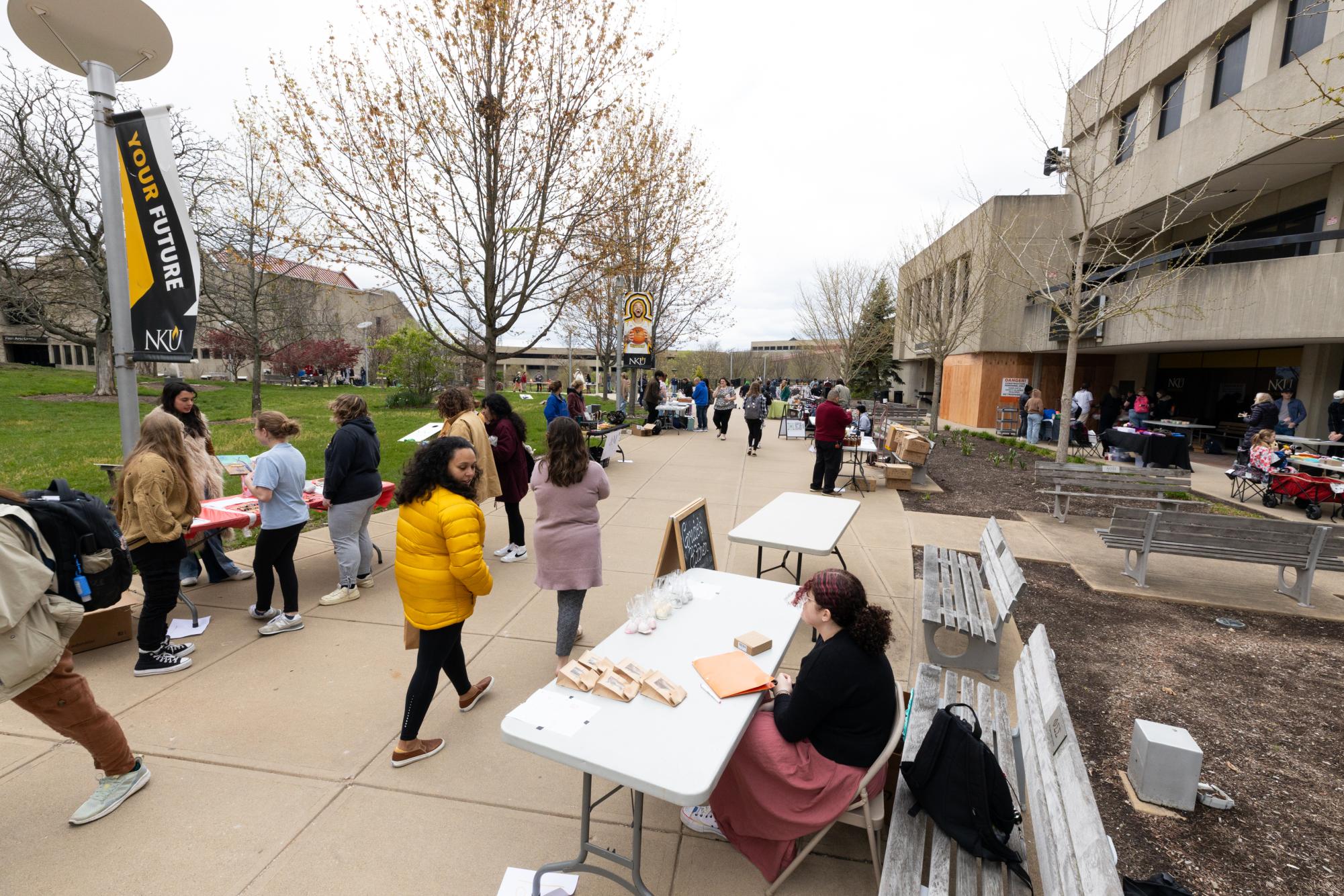 Students present items for sale as a part of their entrepreneurship course in the Student Union plaza.