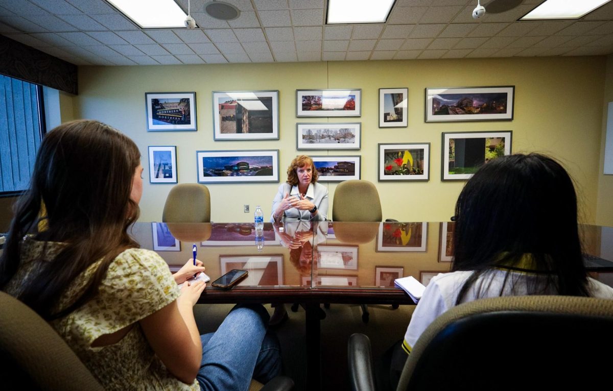 Emily Sisk (left) and Mildred Nguyen (right) interview Dr. Cady Short-Thompson (center) following her announcement as NKU’s seventh president.