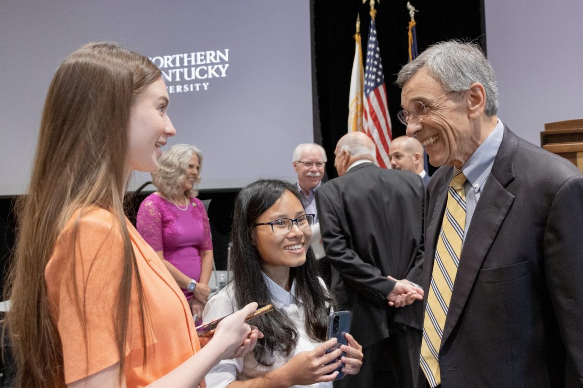 Emily Sisk and Mildred Nguyen talk with President Emeritus James Votruba after Cady Short-Thompson’s announcement as NKU’s seventh president in September 2023. Votruba died earlier this year.
