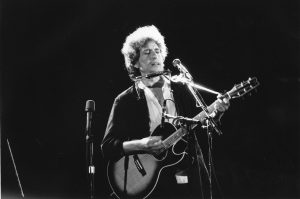 Bob Dylan performs live in this undated photo. Dylan is known for his prolific protest songs of the 20th century.