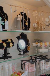 The store has plenty of accessories to choose from, including charm necklaces and makeup bags.