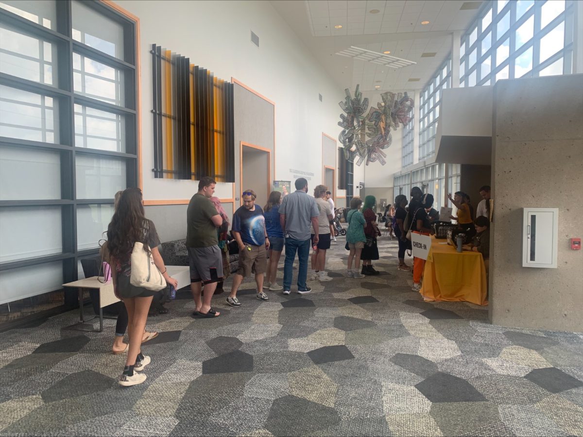 Incoming freshmen wait in line to check in at orientation at the Student Union on Aug. 7, 2025 in Highland Heights, Kentucky.