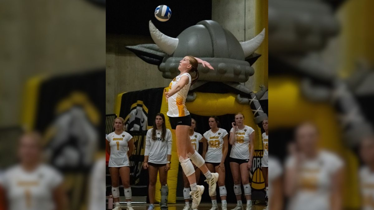 Sophomore Allison Risley (8) serving the ball against Miami (OH). Allison Risley led the Norse with 17 kills, on a .293 hitting percentage, but they lost in five sets, 3-2. 