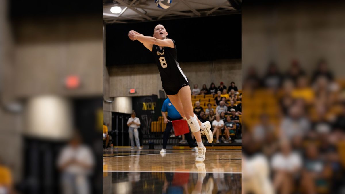 Sophomore Allison Risley (8) goes to bump the ball to set up the attack for the Norse. She put up a stellar performance, with 15 kills, 11 digs and an ace.