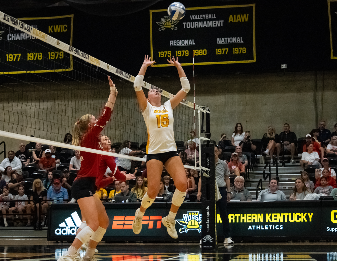Freshman setter Abby Pickard setting the ball up for a spike. In her first home game as a Norse, she posted 47 assists, 15 digs and four kills.