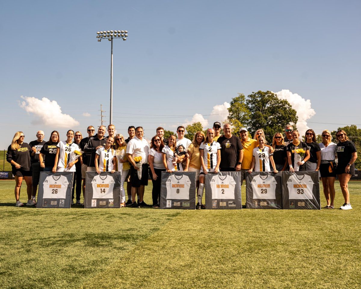 NKU seniors gather with their families for a picture before their matchup against Robert Morris