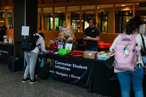 Students assembling car safety kits at Commuter Student Initiatives safe driving event on October 7.