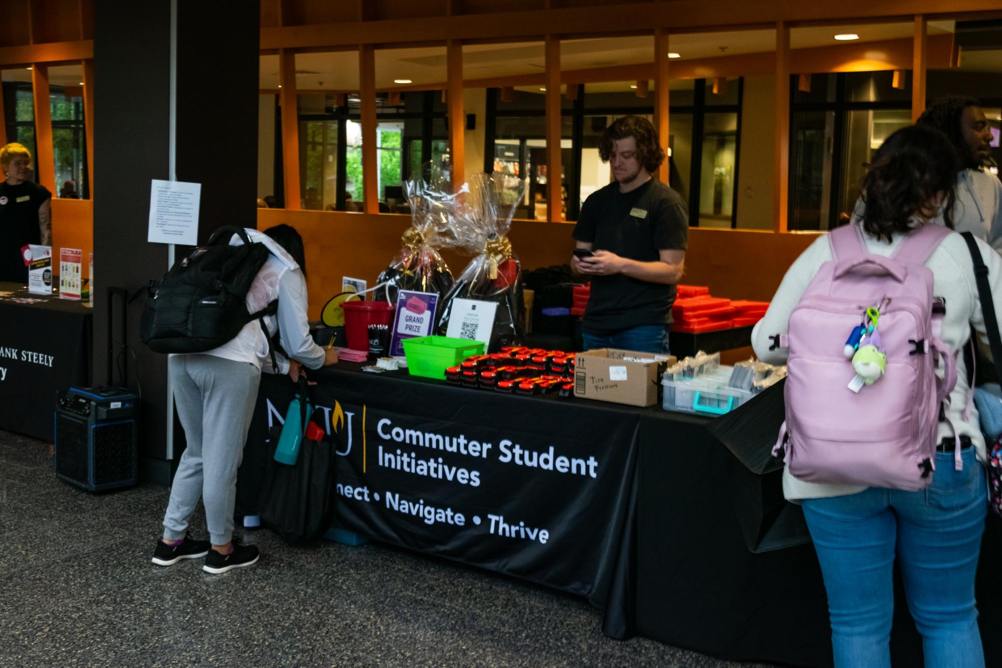 Students assembling car safety kits at Commuter Student Initiatives safe driving event on October 7.
