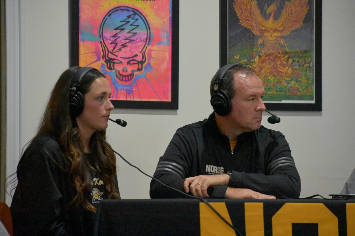 Macey Blevins (left) and Jeff Hans (right) at  Dead Low Brewing for the coaches show hosted by Jim Kelch and Matt Sexton, the radio play-by-play and broadcast voices of Norse basketball. 