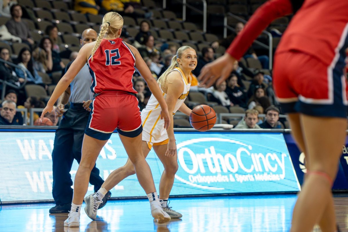 Taysha Rushton (4) running the offense against Southern Indiana. She had 20 points going 4-10 from three and 6-8 from the line.