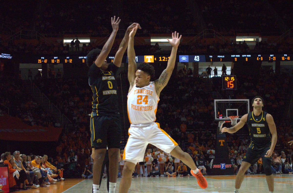 Dan Gherezgher shooting a three pointer. He finished with nine points in the loss against Tennessee. 