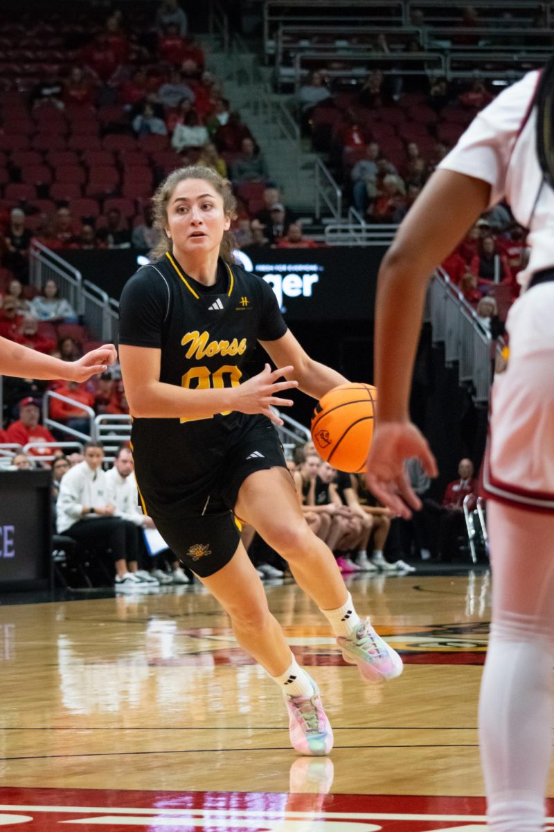  Karina Bystry driving the ball against the Louisville defense. Led the Norse with 15 points against Butler, shooting 7-9 from the free throw line.