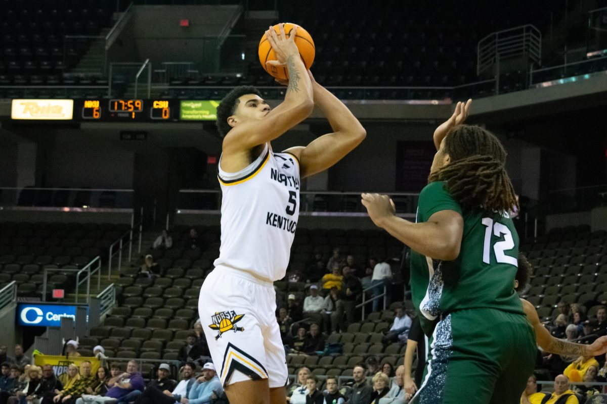 LJ Wells (5) putting up a shot against Holden Pierre-Louis (12). Wells led the Norse in scoring with 21 points, going 8-12 from the floor.