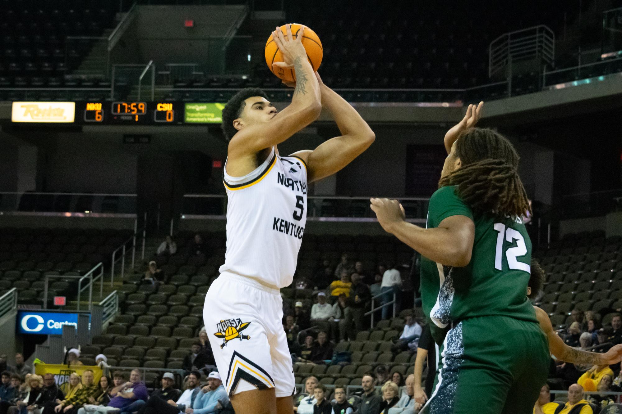 LJ Wells (5) putting up a shot against Holden Pierre-Louis (12). Wells led the Norse in scoring with 21 points, going 8-12 from the floor.