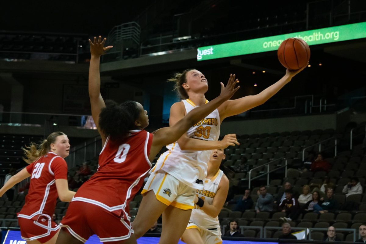 NKU’s Maddie Moody (30) going up for the layup against Bradley’s Kaylen Nelson (0). The Cincinnati native had another big night, with 17 points, four rebounds and two assists. 