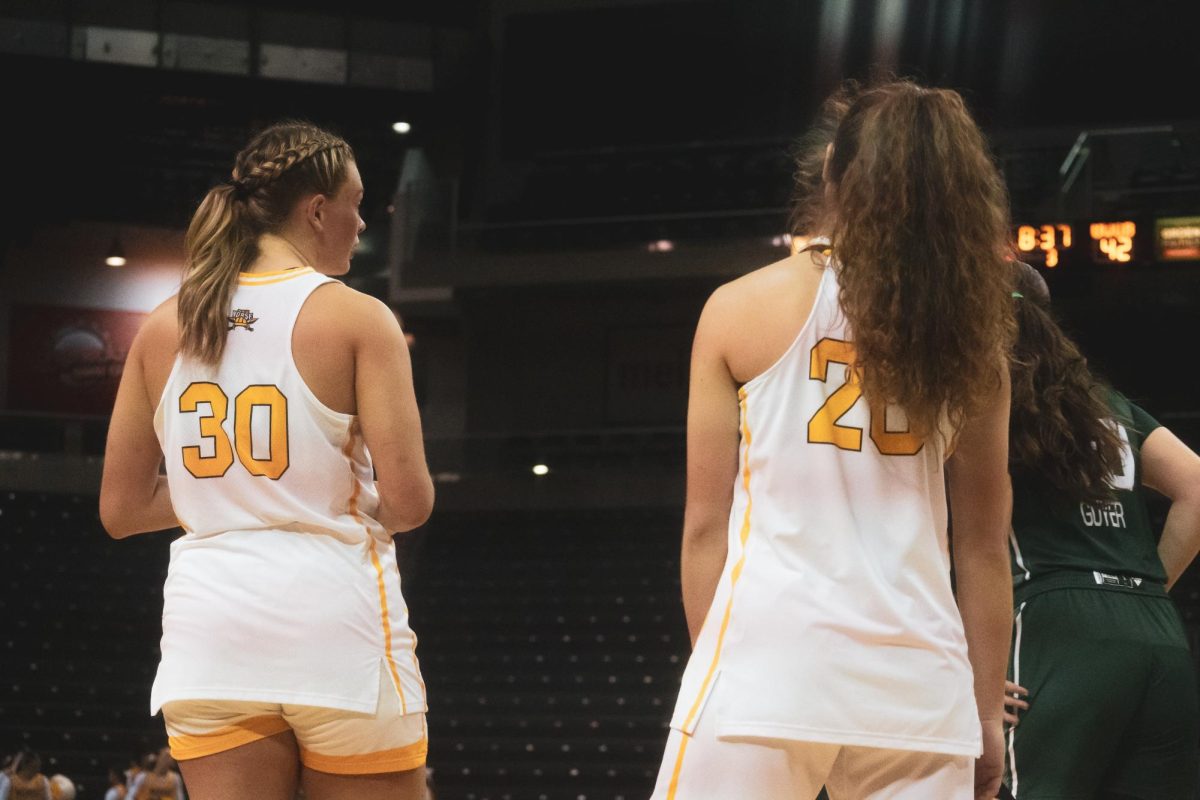 Maddie Moody (30) (left) and Karina Bystry (20) (right) getting ready for the action to start. Moody had 11 points and seven rebounds and Bystry had six points, five rebounds and four steals against Green Bay. 