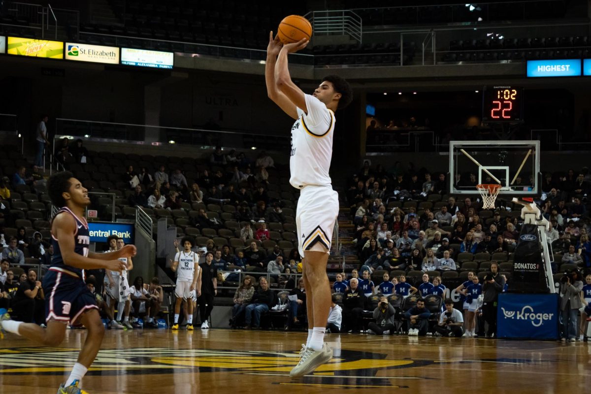 Senior LJ Wells (5) lining up an open three. Wells recorded a career high 35 points and swished in a pair of threes from beyond the arc. 