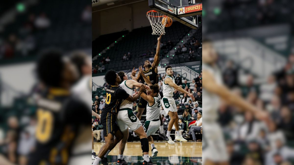 Donovan Oday is going for a hard-fought layup against Green Bay defenders. He had himself a career night in the loss to Green Bay, scoring 31 points on 10-15 shooting.