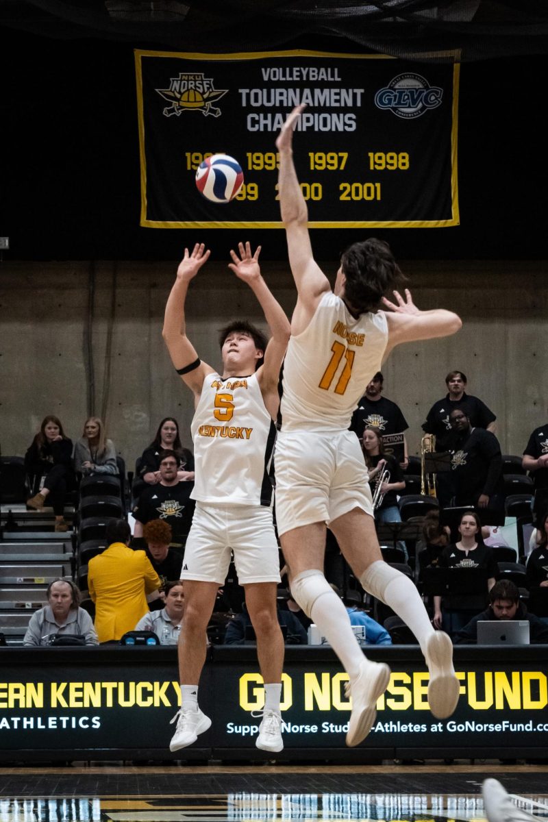 Freshman setter Nick Whitley (5) setting up freshman middle blocker Ryan Peterson (11). Whitley had five assist on the night while Peterson had one kills on four attacks.