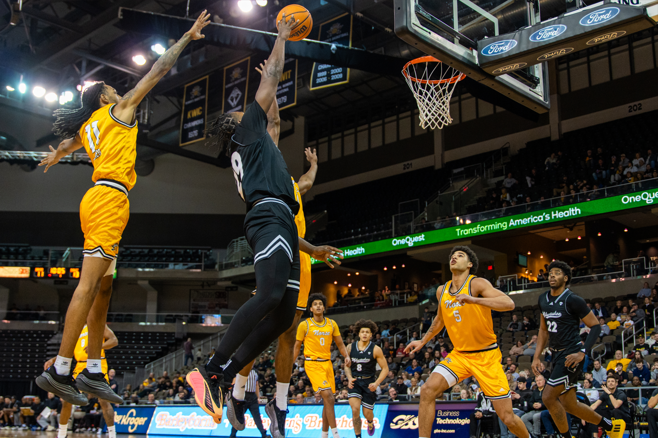 Redshirt Senior Aaron Franklin (29) going up for the layup against NKU defenders. Franklin put up a double-double with ten points and ten rebounds, while adding four assists. 