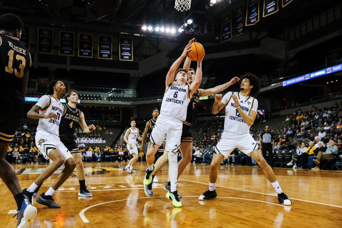 Freshman Ethan Elliot (6) going up for a contested layup. Elliot was a perfect 4-4 from the field, recording nine points