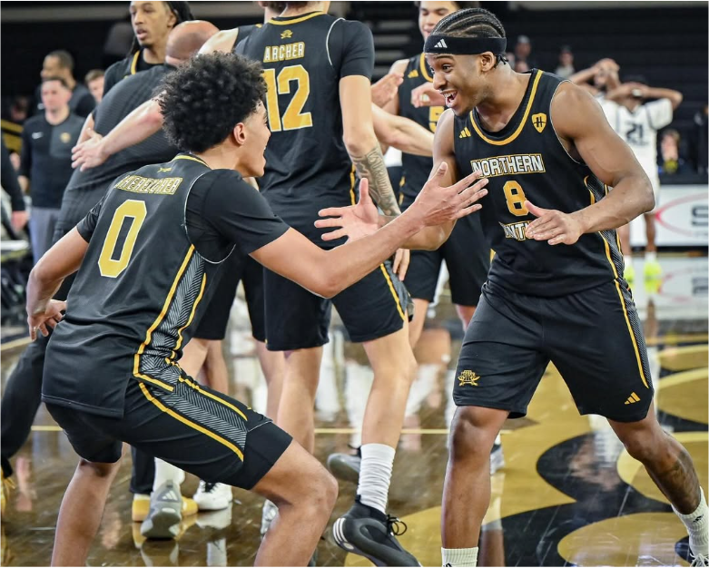 Dan Gherezger (0) and Donovan Oday (8) celebrating the win over Oakland in the first round of the Horizon League tournament.